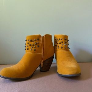 Yellow studded ankle boots from Urban Outfitters.